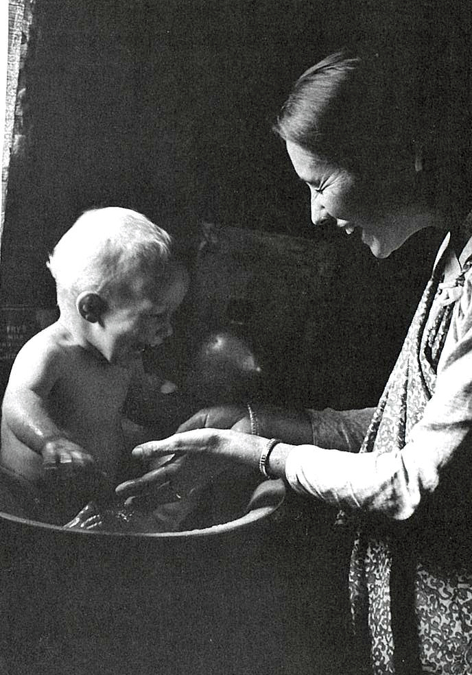 Nancy Watters gives Daniel Watters a bath.